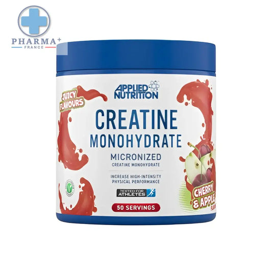Contenant cylindrique bleu d’applied nutrition créatine monohydrate saveur cerise pomme avec étiquette blanche et éclaboussures rouges