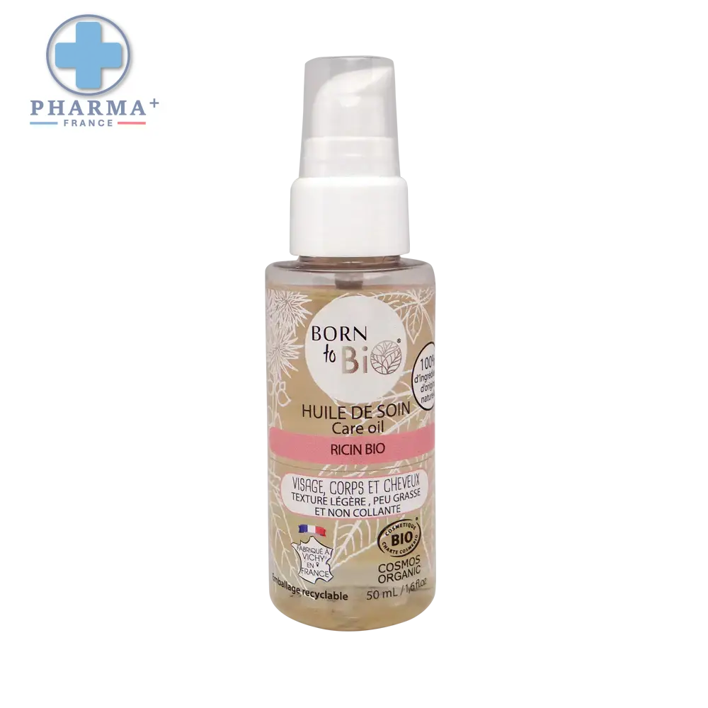 Bouteille en verre claire dhuile sèche born to bi ricin bio certifiée biologique avec pompe blanche étiquette beige fleurie